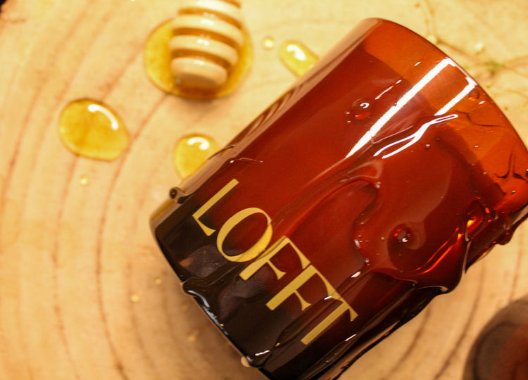 Lofft Candle, Amber Candle Jar with our Golden Honey scent, image shows candle covered in honey